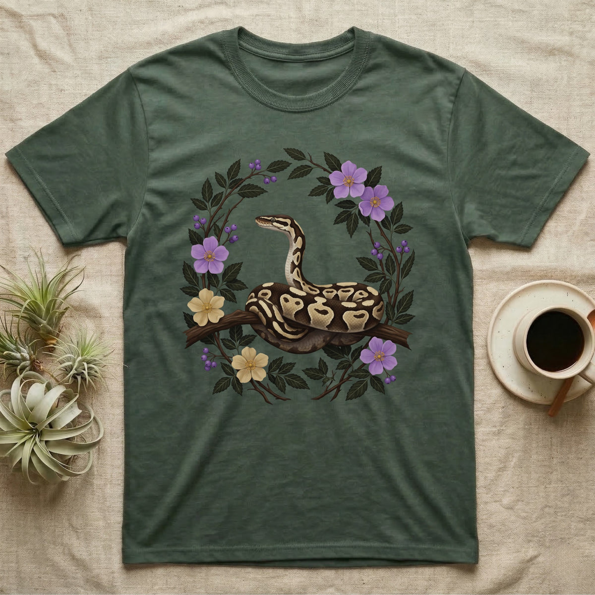 Ball Python Opinions Television T-Shirt in Military Green — Oil-painted ball python coiled on a branch, enclosed by a dense oval bower of flowering bramble.