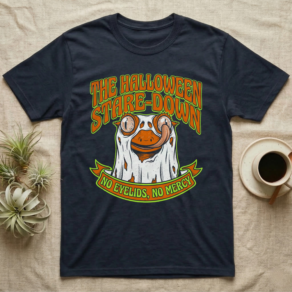 Crested Gecko Halloween Stare-Down T-Shirt in Navy — Retro-horror crested gecko in a ghost sheet licking its eye, "The Halloween Stare-Down, No Eyelids No Mercy."