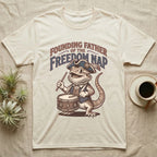 Bearded Dragon Drummer T-Shirt in Natural — Sepia woodcut bearded dragon as a Revolutionary drummer boy under ornate text Founding Father of the Freedom Nap.