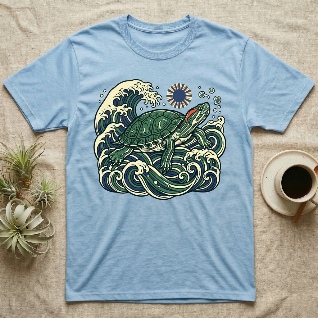 Blue t-shirt with a stylized turtle and wave design.