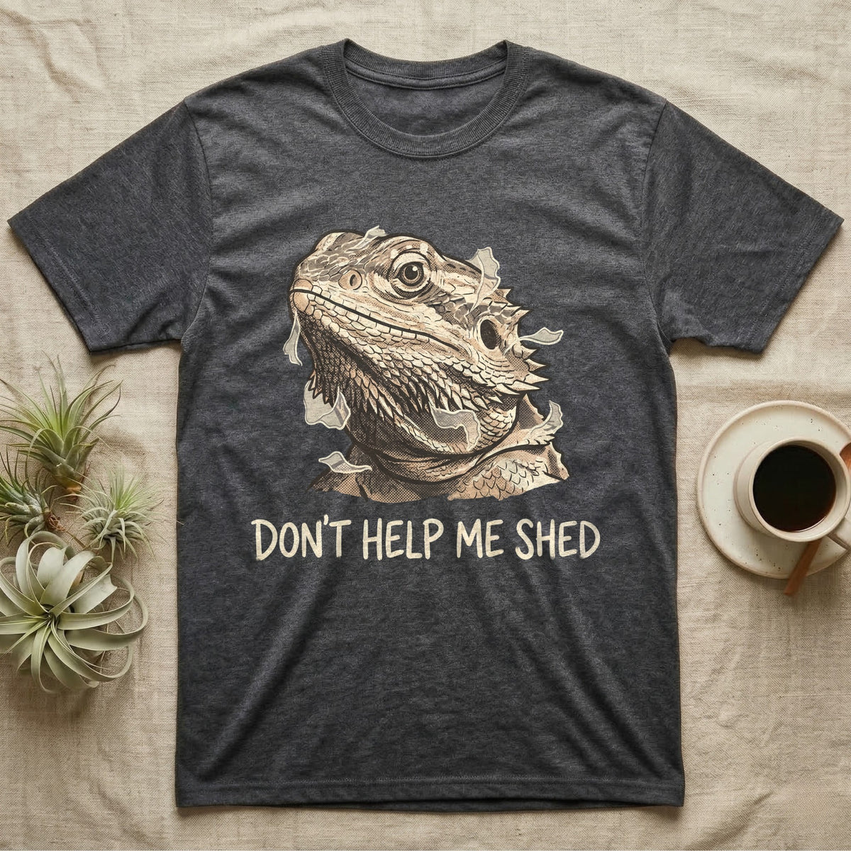 Don't Help Me Shed T-Shirt in Dark Heather — Retro-illustration of a bearded dragon mid-shed with a deadpan side-eye and a marker caption reading Don't Help Me Shed.