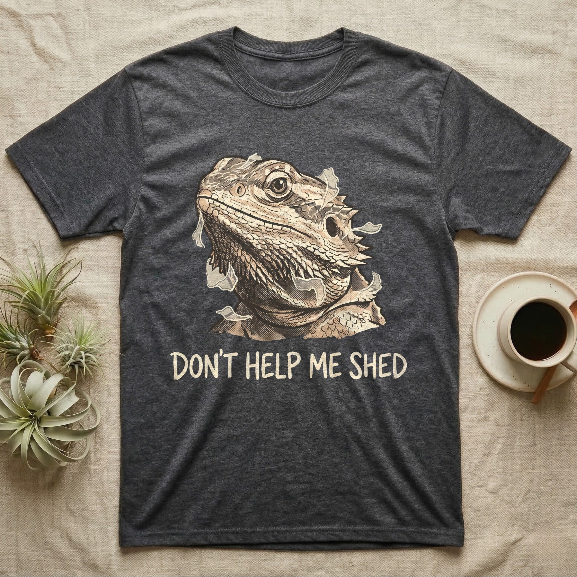 Don't Help Me Shed T-Shirt in Dark Heather — Retro-illustration of a bearded dragon mid-shed with a deadpan side-eye and a marker caption reading Don't Help Me Shed.