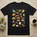 Box Turtle Specimen Plate T-Shirt in Black — Twenty-five turtles and tortoises painted flat in chalky colour, scattered across grey, each facing a different way.