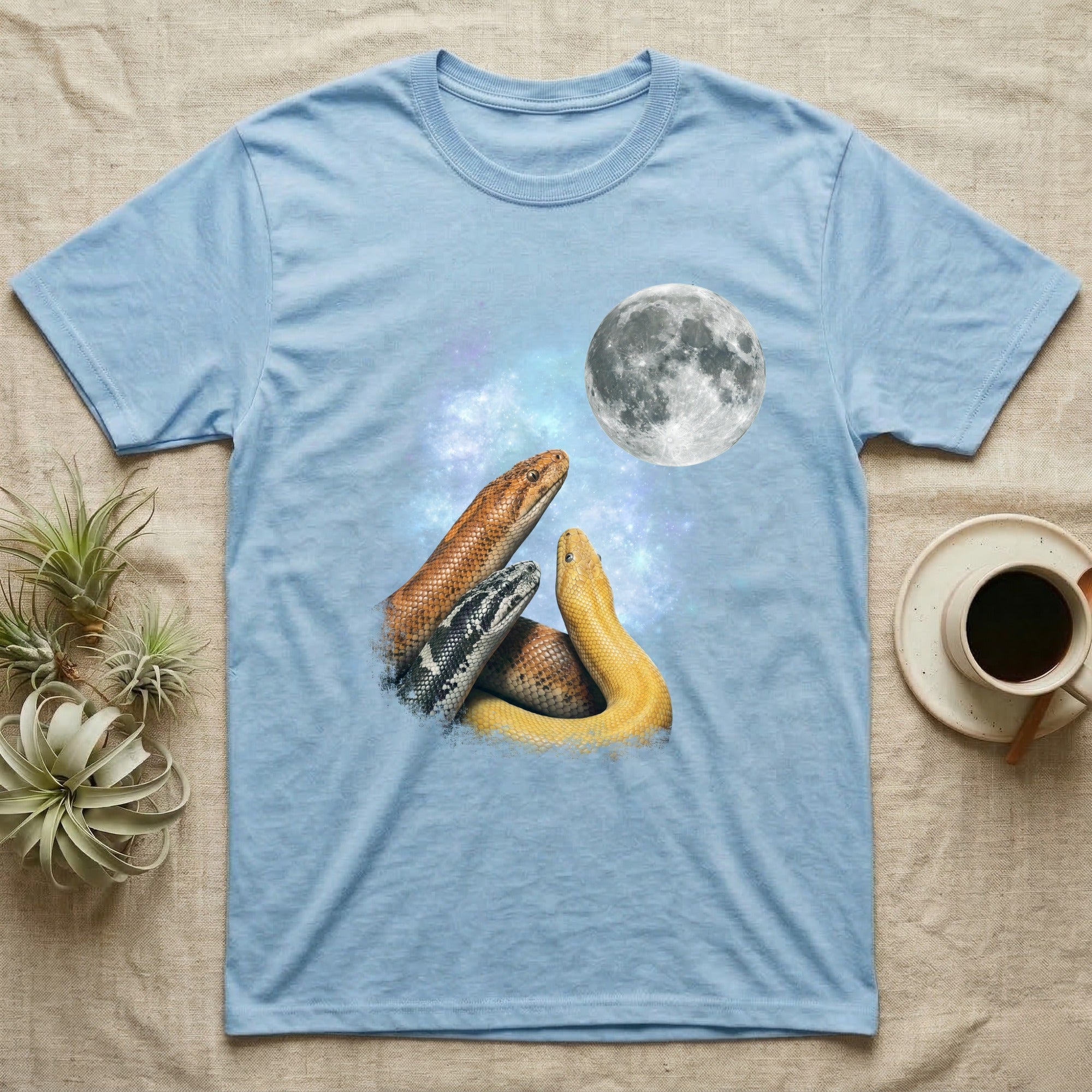 Kenyan Sand Boa Moon Howl T-Shirt in Light Blue — Three Kenyan Sand Boa colour morphs howling at a full moon over a nebula on a dark grey t-shirt.