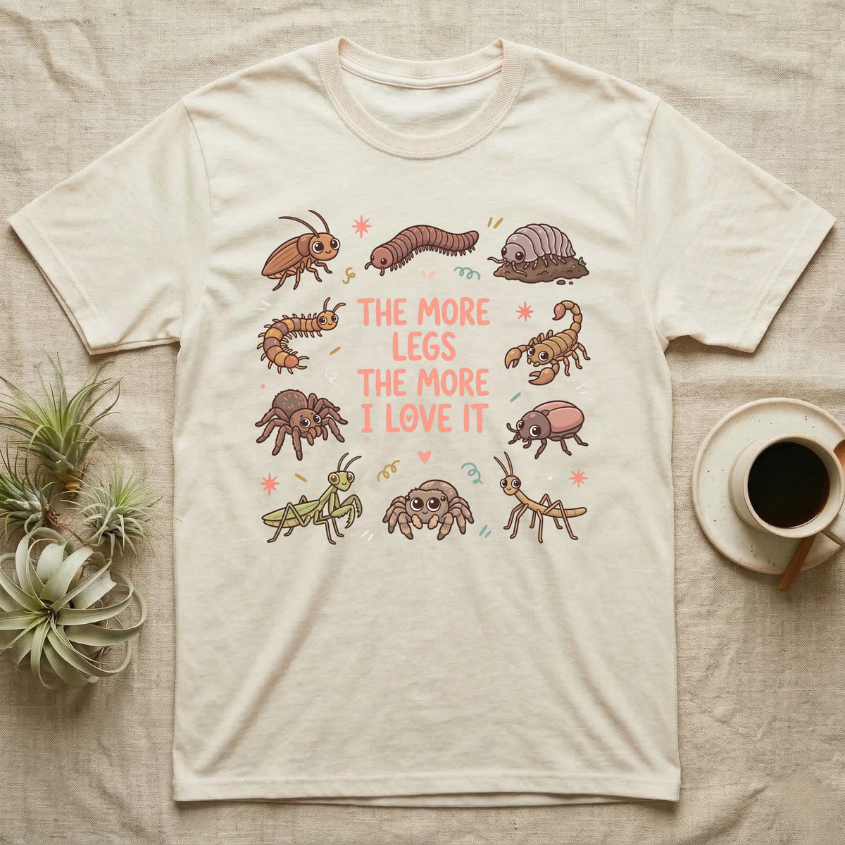 Invert More Legs T-Shirt in Natural — Ten cartoon roaches, isopods, scorpions and other inverts around coral-pink words THE MORE LEGS THE MORE I LOVE IT