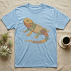 Light blue t-shirt with a colorful, patchwork bearded dragon graphic.