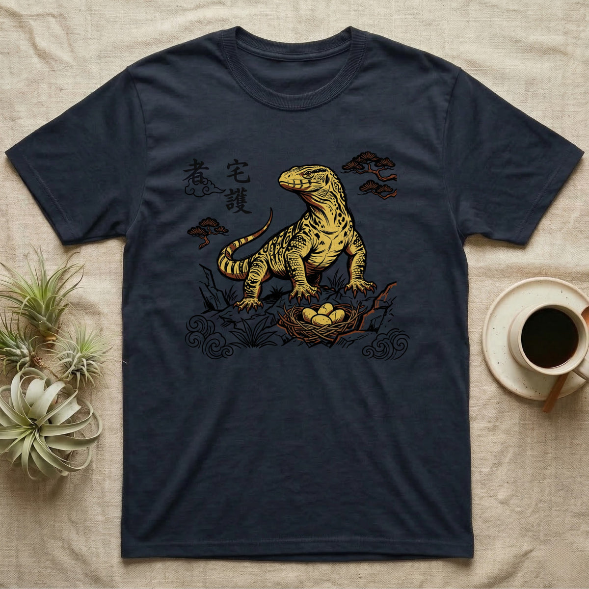 Dark t-shirt with yellow Komodo dragon and eggs design and Asian script.