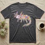Axolotl Watercolour Mosaic T-Shirt in Dark Heather — Watercolour mosaic axolotl made of painted flowers and leaf blades, gill plumes fanned, petals trailing from its tail