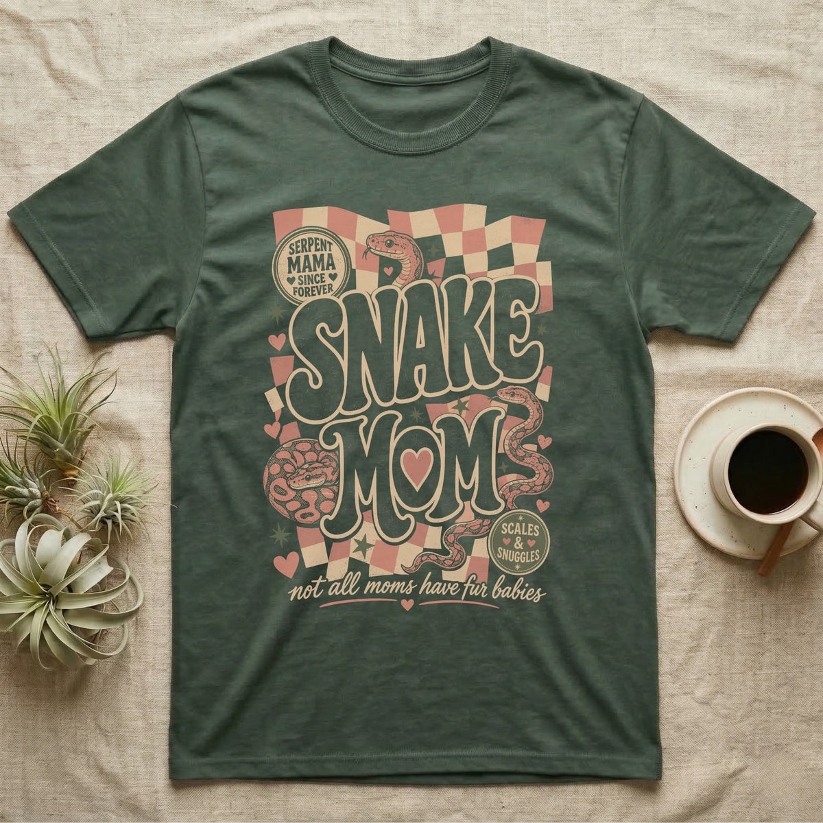 Serpent Mama graphic t-shirt with snakes, hearts, and text.