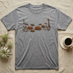 Box Turtle Forest Floor T-Shirt in Sport Grey — Sepia ink and wash illustration of eight eastern box turtles crossing open woodland between two deadfall trunks.