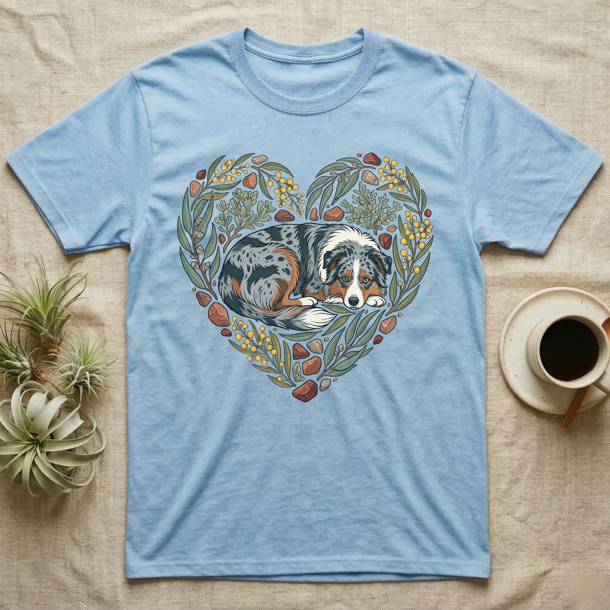 Blue t-shirt featuring a dog in a heart-shaped floral wreath.