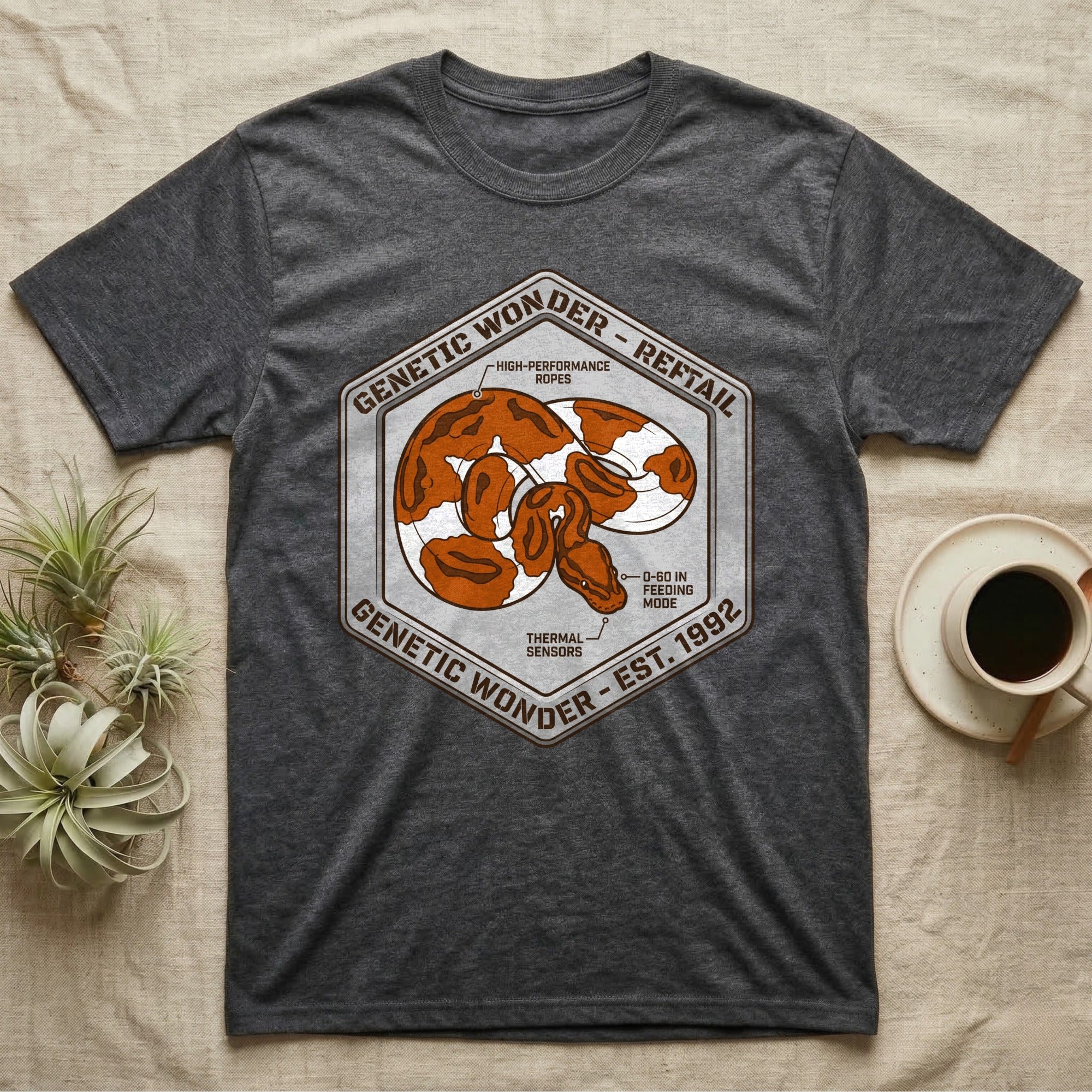 Dark grey t-shirt with hexagonal snake logo and text.