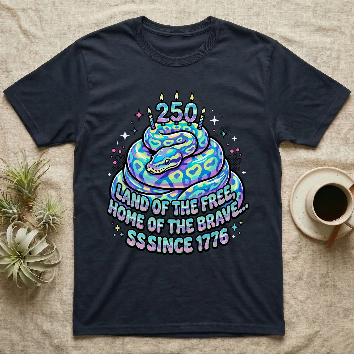 Ball Python Birthday Cake T-Shirt in Navy — Y2K pastel ball python coiled as a birthday cake with 250 candles and bubble text Land of the Free, Sssince 1776.