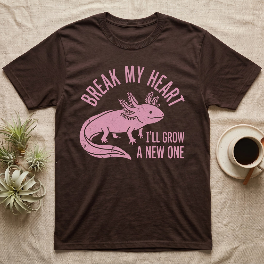 Axolotl Regrow T-Shirt in Dark Chocolate — Worn one-ink pink axolotl walking side-on, gills spread, under Break My Heart, I'll Grow a New One