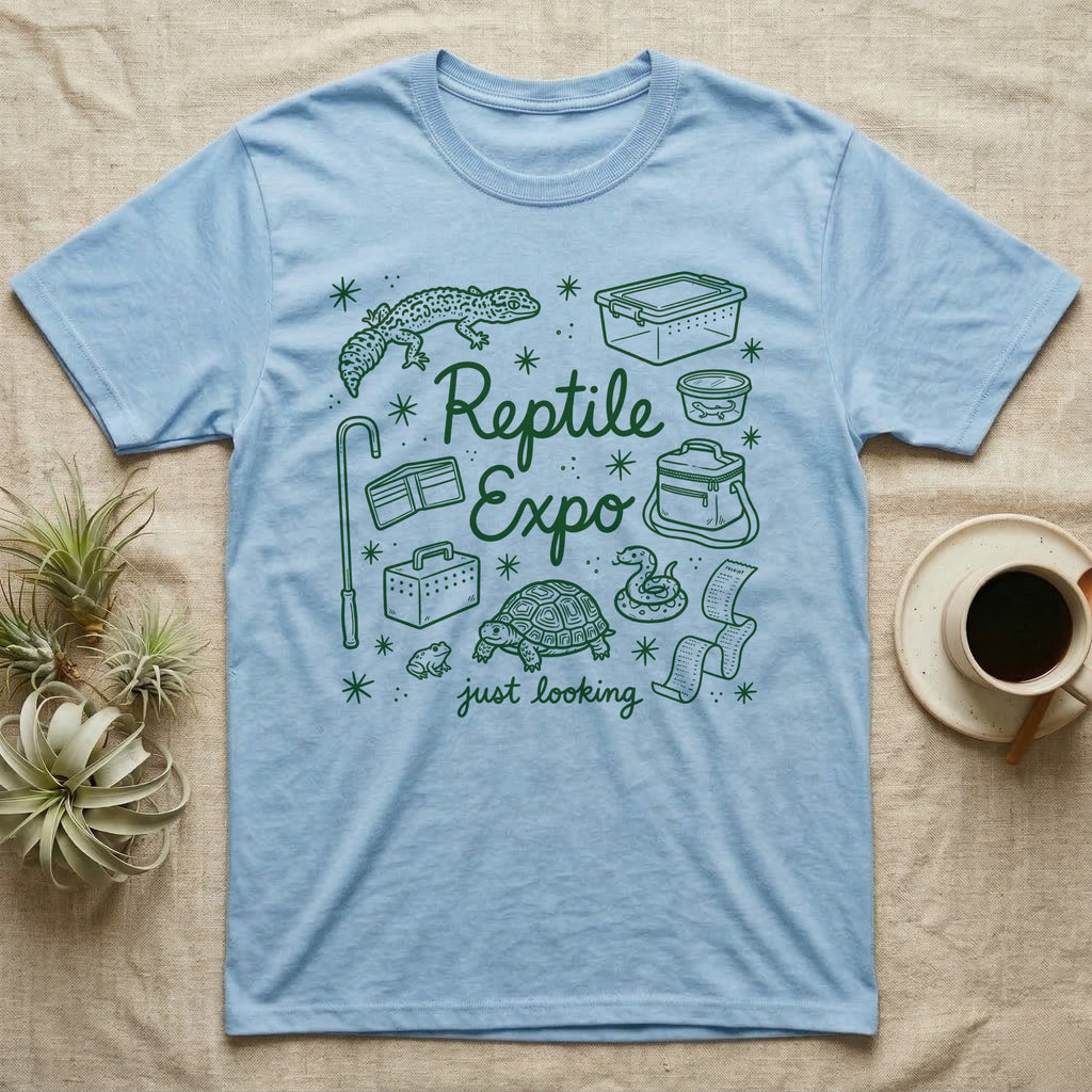 Reptile Expo T-Shirt in Light Blue — Green marker cursive reading Reptile Expo just looking, ringed by doodles of deli cups, tubs, a gecko and a tortoise