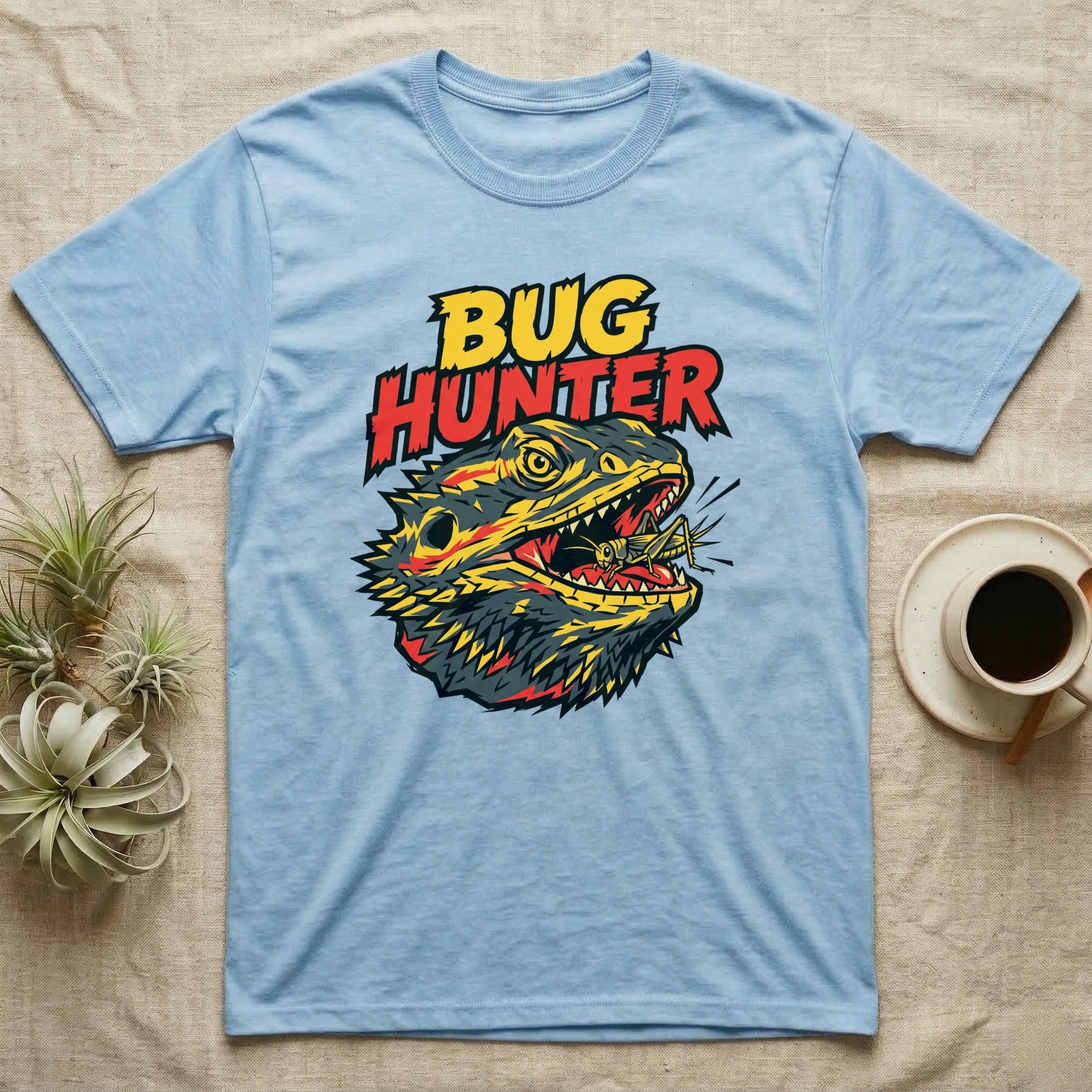 Light blue t-shirt with "Bug Hunter" text and a lizard eating a grasshopper.