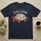 Red-Foot Tortoise Slow Living T-Shirt in Navy — Flat watercolour mosaic of a red-foot tortoise built entirely from terrarium flowers and ferns.