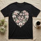 Black t-shirt with a heart-shaped floral design featuring orchids and a praying mantis.