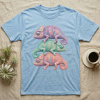 Three colorful chameleons stacked on a light blue t-shirt.