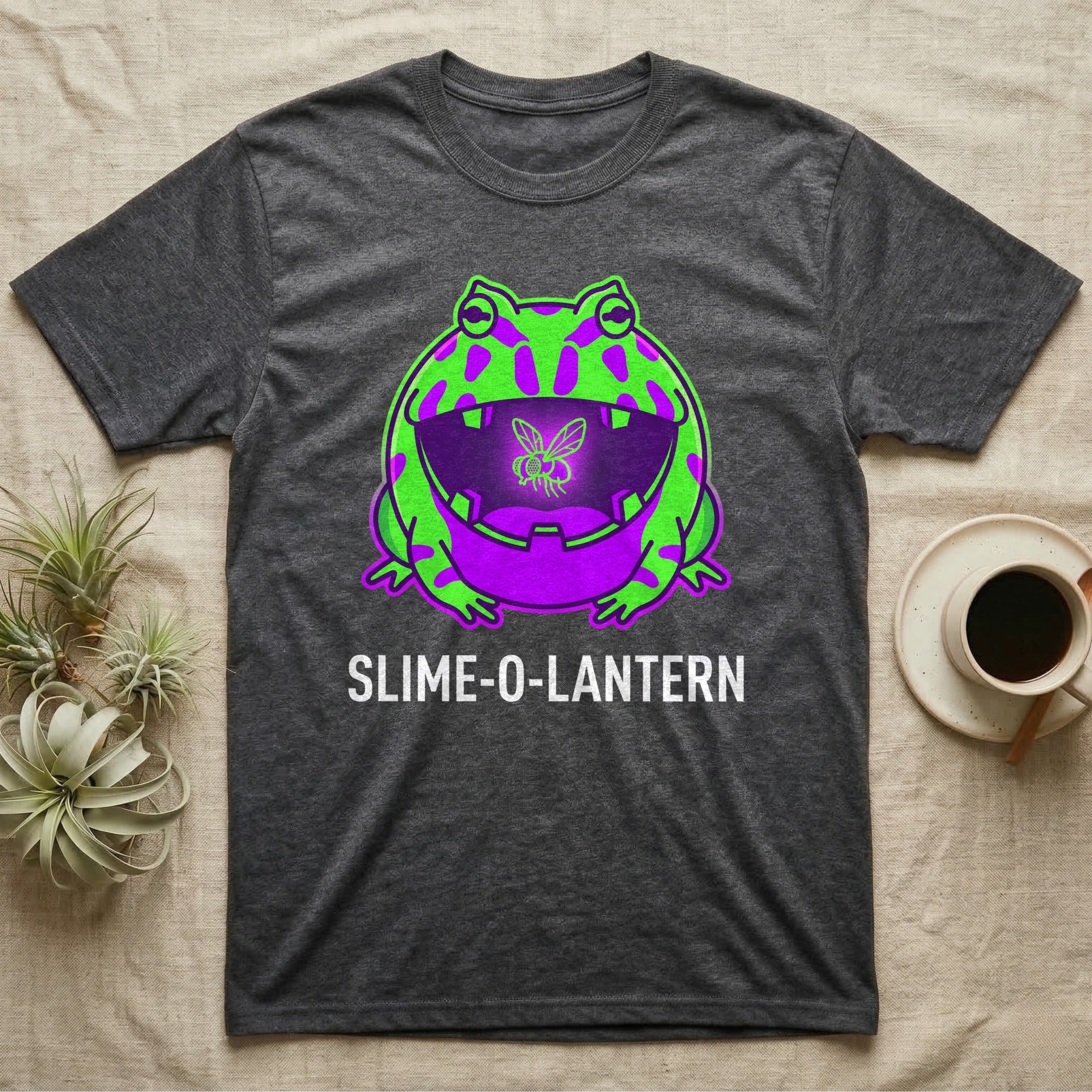 Pacman Frog Slime-O-Lantern T-Shirt in Dark Heather — Neon pop-art Pacman frog shaped like a jack-o'-lantern with a lit fly in its mouth, "Slime-O-Lantern."