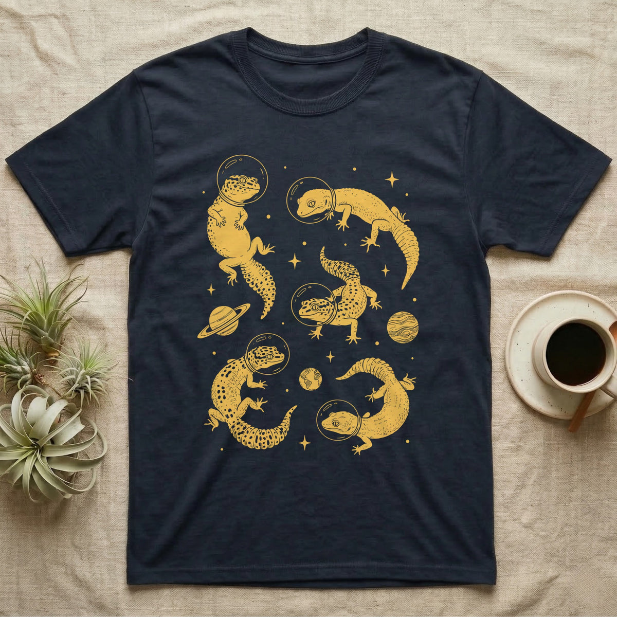 Leopard Gecko Cosmic T-Shirt in Navy — Vintage screen-print illustration of leopard geckos in astronaut helmets floating in space, sulfur amber monochromatic on dark background.