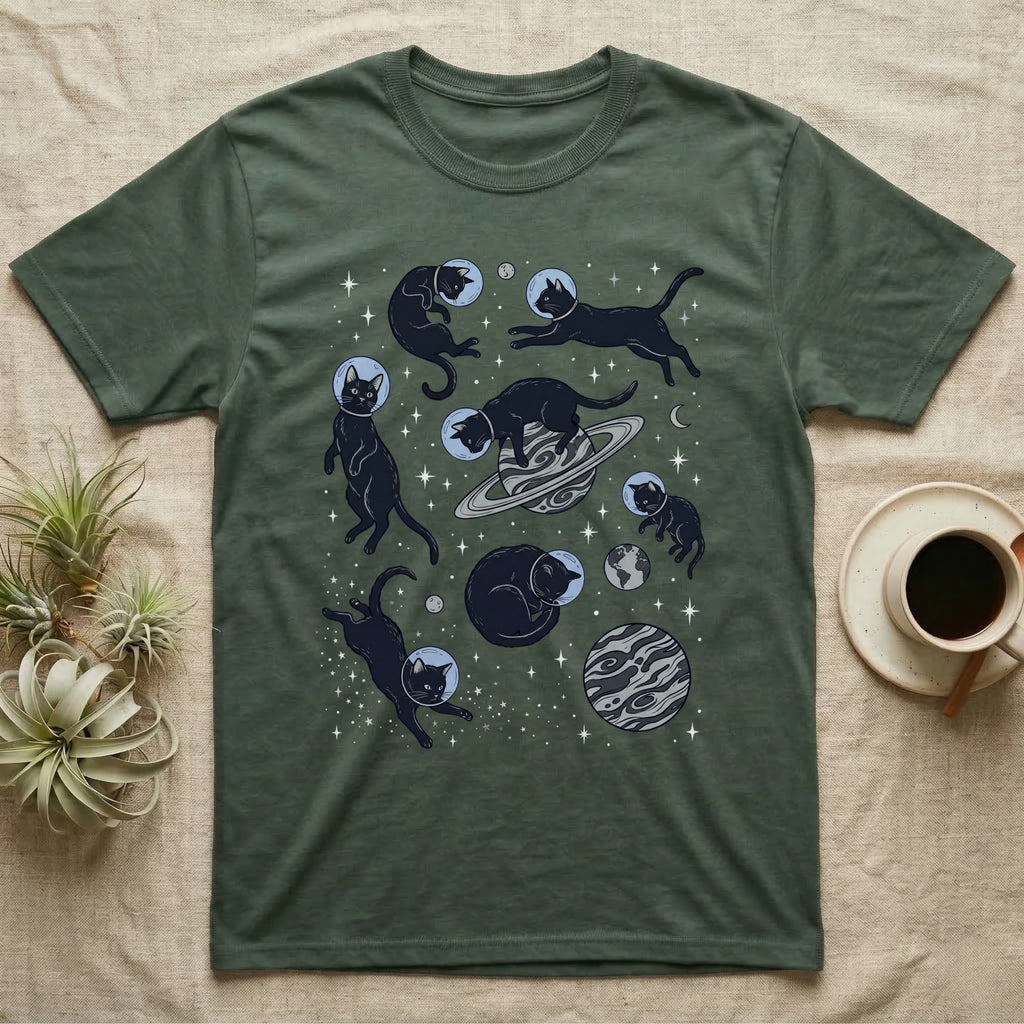 Green t-shirt with a galaxy of black cats floating among planets and stars.