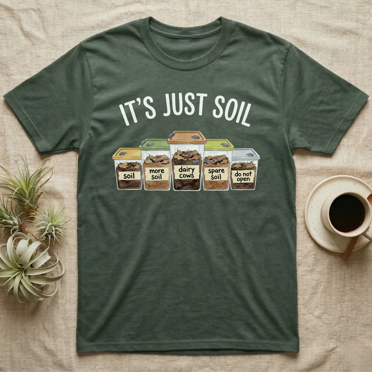 Isopod Soil Bins T-Shirt in Military Green — Watercolour row of five labelled bins of soil with isopods on the lids under the words IT'S JUST SOIL