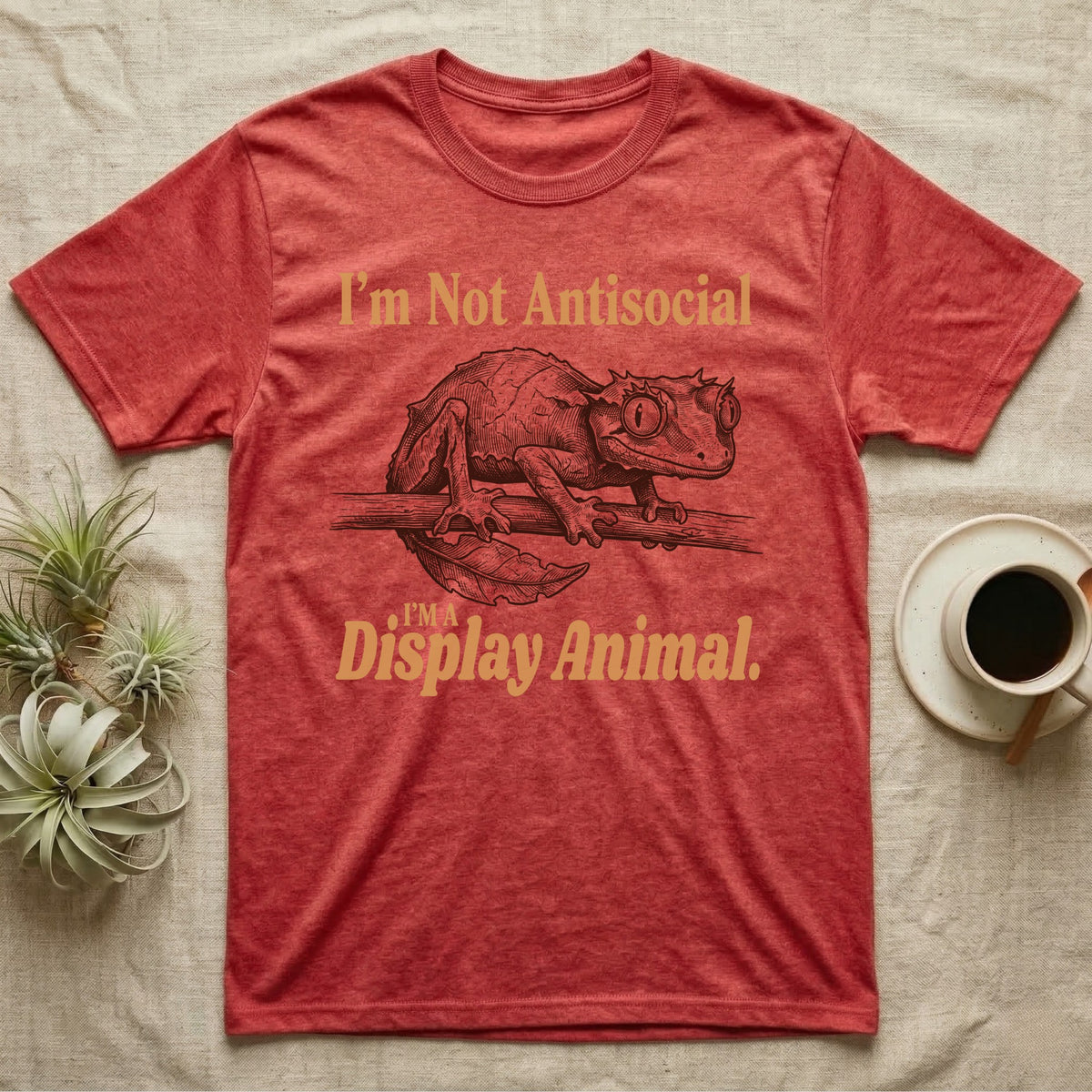 Leaf-Tailed Gecko Display T-Shirt in Heather Red — Engraved satanic leaf-tailed gecko on a branch staring out, with the words I'm Not Antisocial, I'm a Display Animal