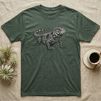 Green t-shirt with a black and white drawing of a tegu lizard.