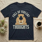 Capybara Violent Thoughts Tee in Navy — Vector-bold portrait of a serenely half-smiling capybara framed by cream slab typography reading "Full Of Violent Thoughts."