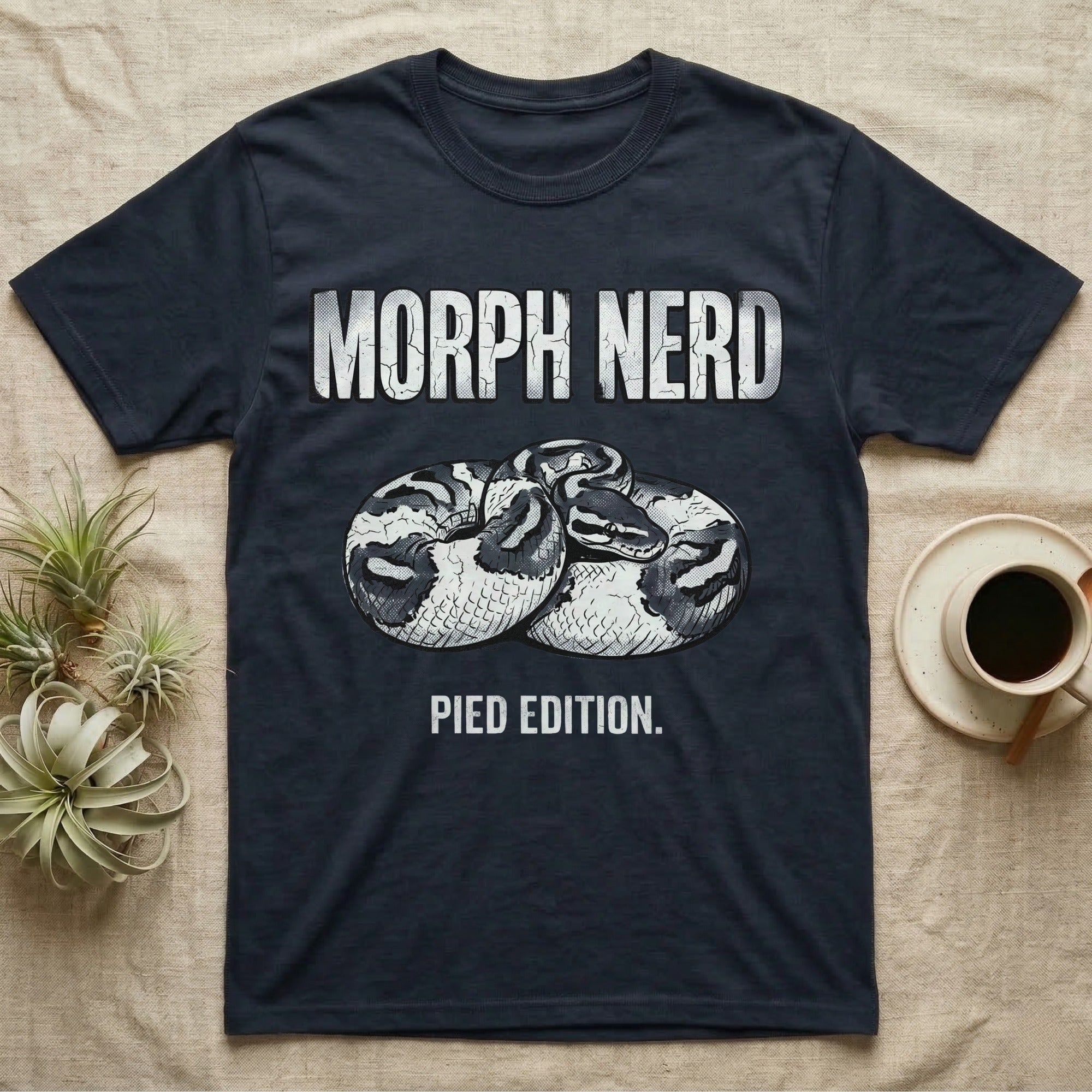 Pied Ball Python Morph T-Shirt in Navy — Grunge type "Morph Nerd" with a small pied-morph ball python coiled mid-design and "Pied Edition" caption beneath.