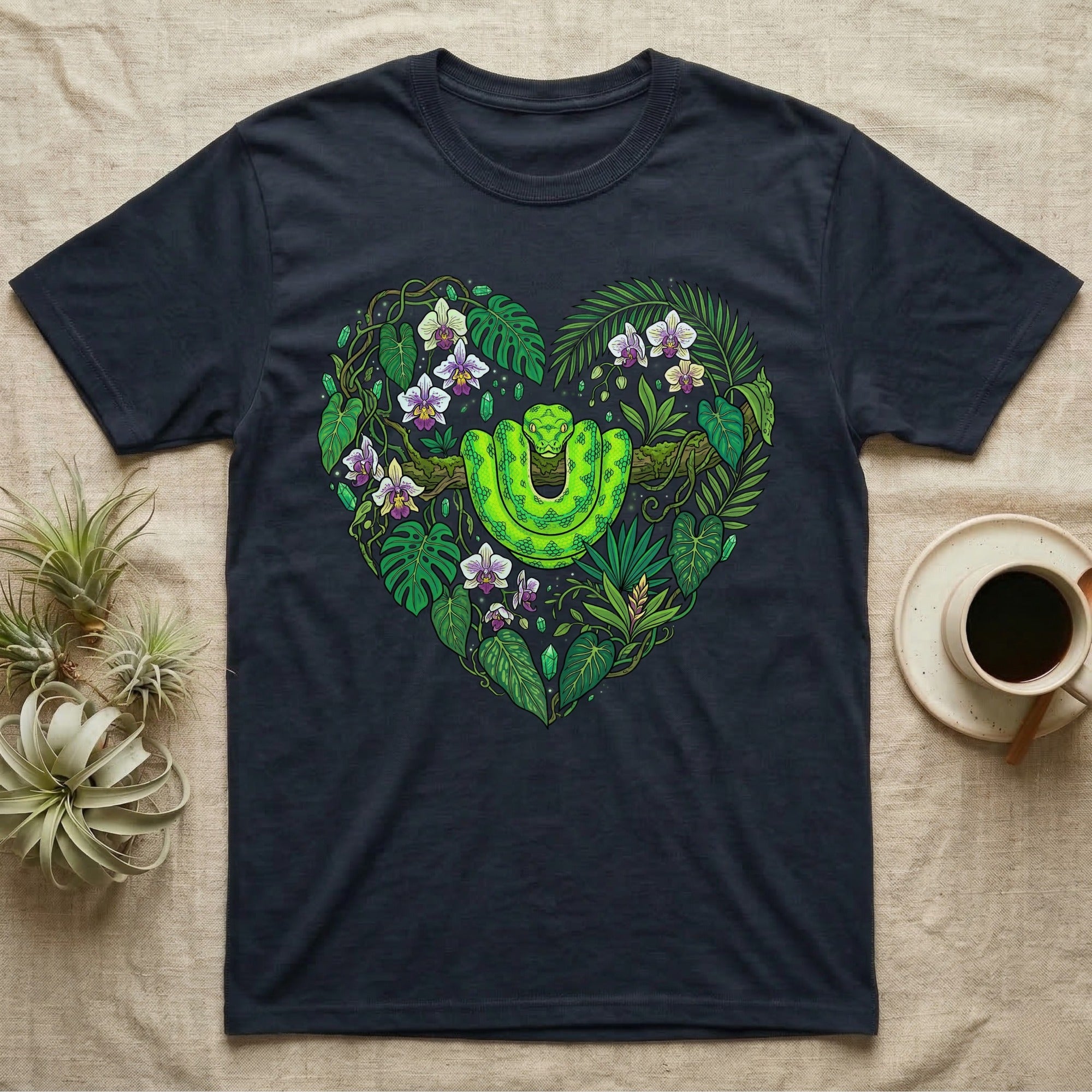 Dark t-shirt with a heart-shaped jungle design featuring a green snake.