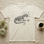 Ackie Monitor Meltdown T-Shirt in Natural — A charcoal drawing of an ackie monitor hissing furiously at one small, calm cricket, with lightning bolts around its head.