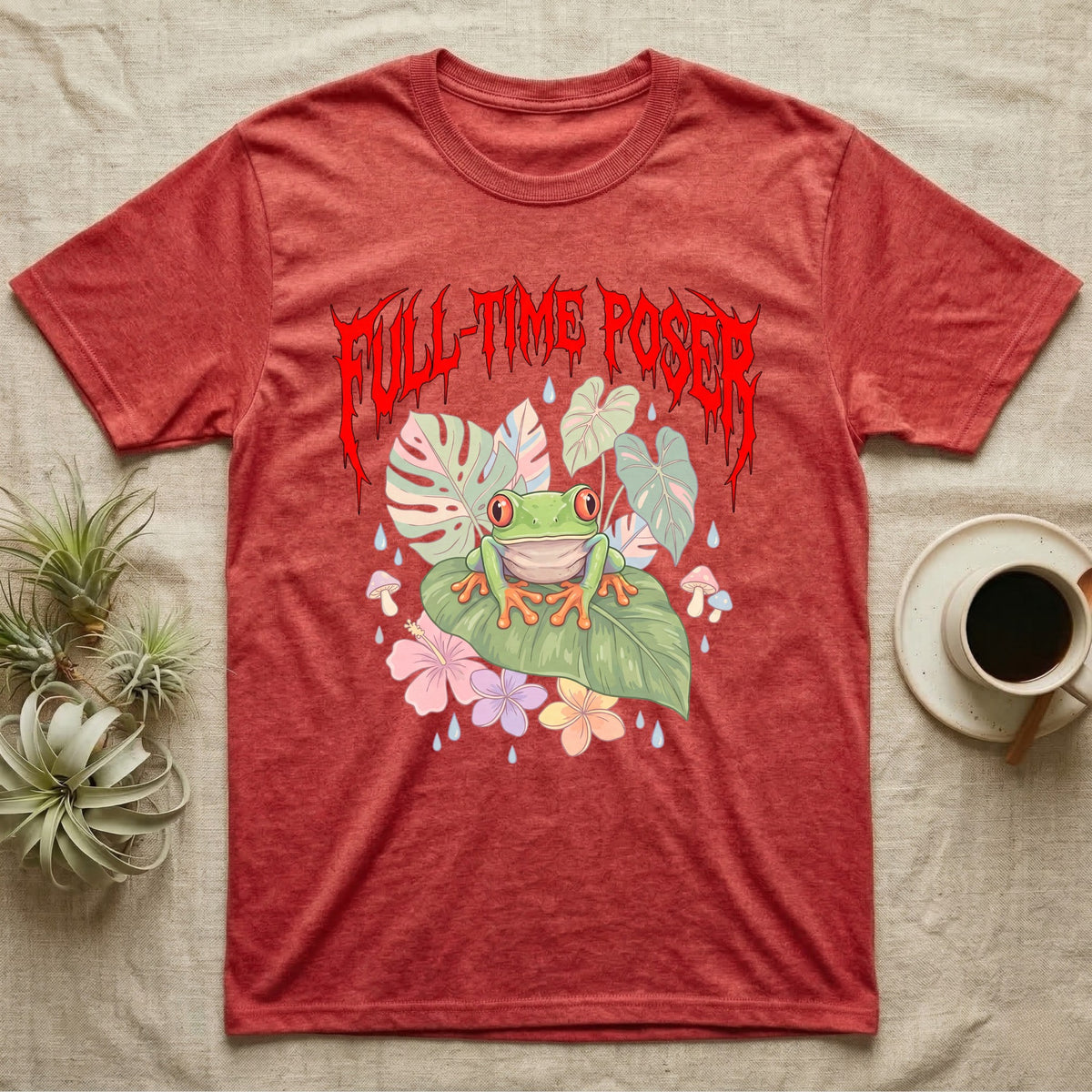 Red-Eyed Tree Frog Feral T-Shirt in Heather Red — Red-eyed tree frog on a leaf in a pastel jungle scene under a spiky red metal wordmark reading FULL-TIME POSER.