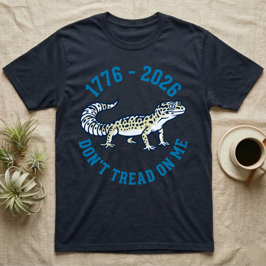 Leopard Gecko 1776 T-Shirt in Navy — Two-colour vector leopard gecko in profile ringed by arched text reading 1776 to 2026 and Don't Tread On Me.