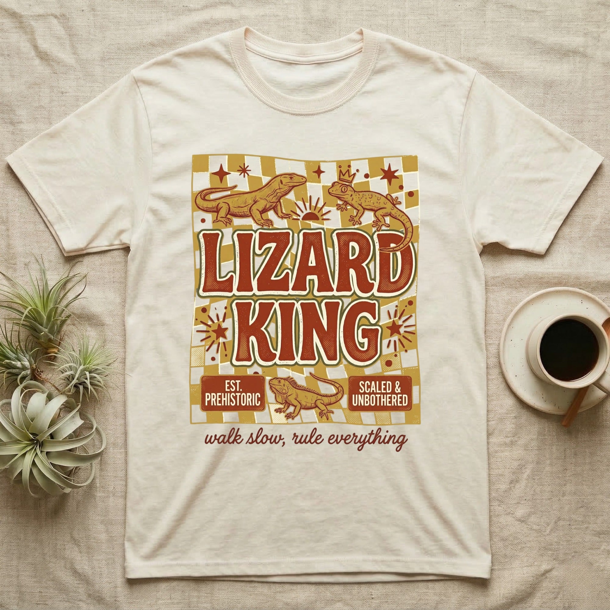 Cream t-shirt with "Lizard King" graphic, featuring geckos and checkered pattern.
