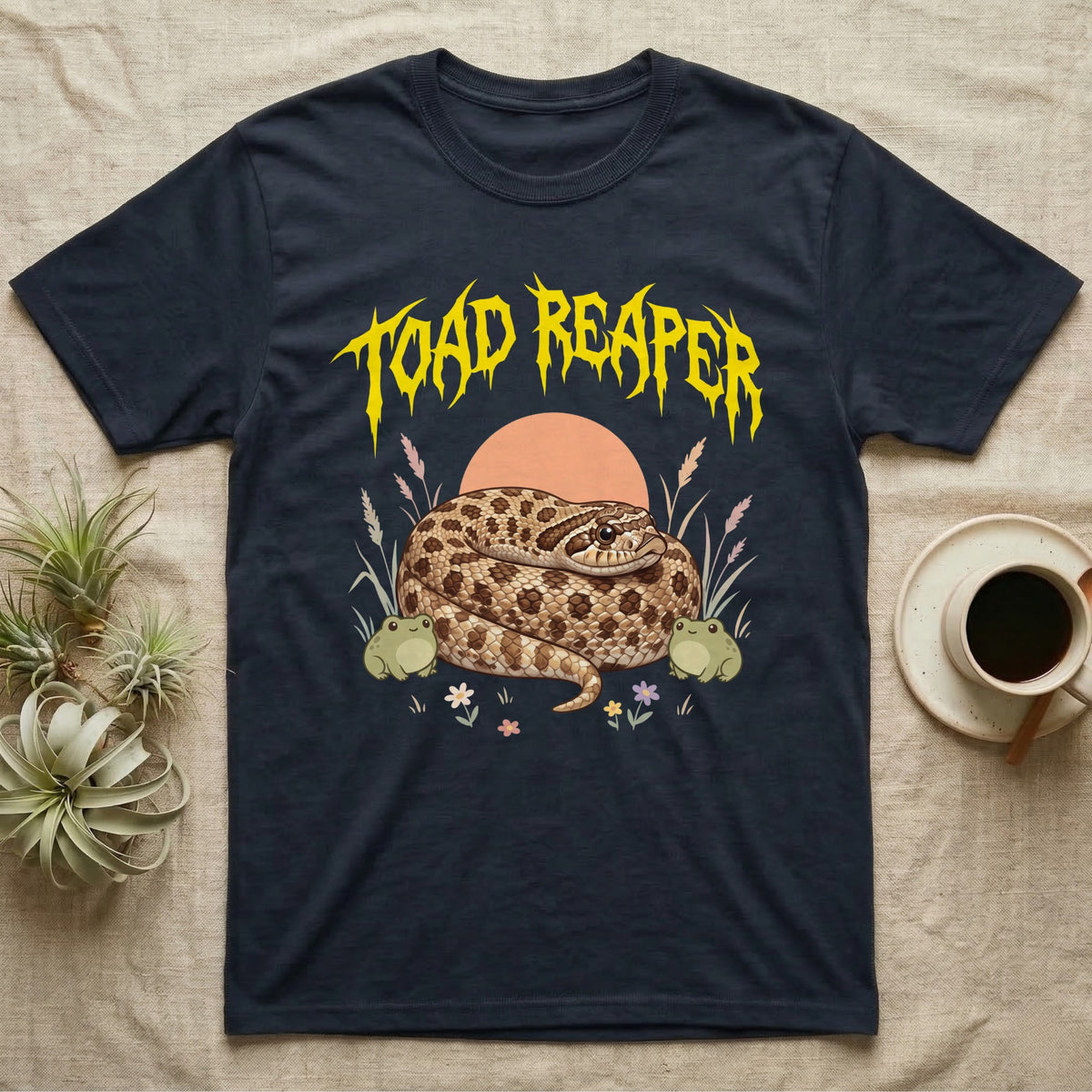 Hognose Toad Reaper T-Shirt in Navy — Realistic western hognose coiled in a loaf between two cartoon toads under jagged yellow lettering: TOAD REAPER