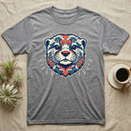Grey t-shirt with otter face design in blue, white, and red waves.