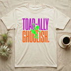 Tree Frog Toad-ally Ghoulish T-Shirt in Natural — Neon green tree frog with a pumpkin pail clinging across stacked text, "Toad-ally Ghoulish."