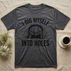 Russian Tortoise Digging T-Shirt in Dark Heather — Etched Russian tortoise digging headfirst into an earth bank, only its back end out, with the words I Dig Myself Into Holes