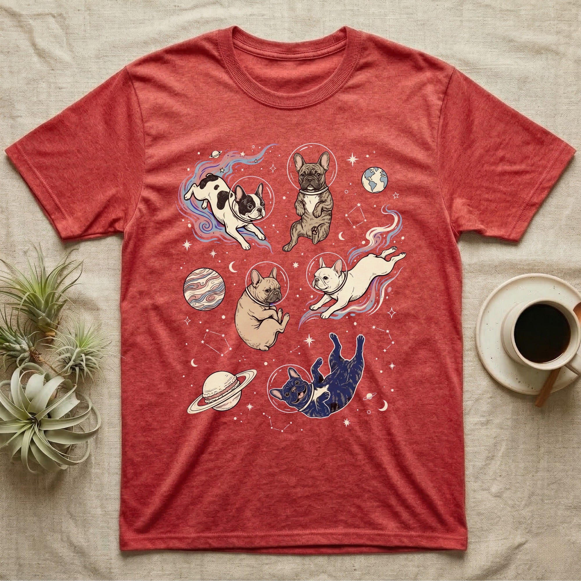 Red t-shirt with French bulldogs in space, planets, and stars design.