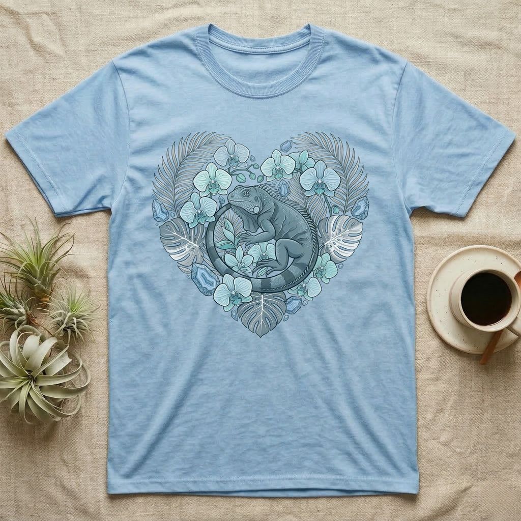 Light blue t-shirt with a heart-shaped floral design featuring a grey iguana.