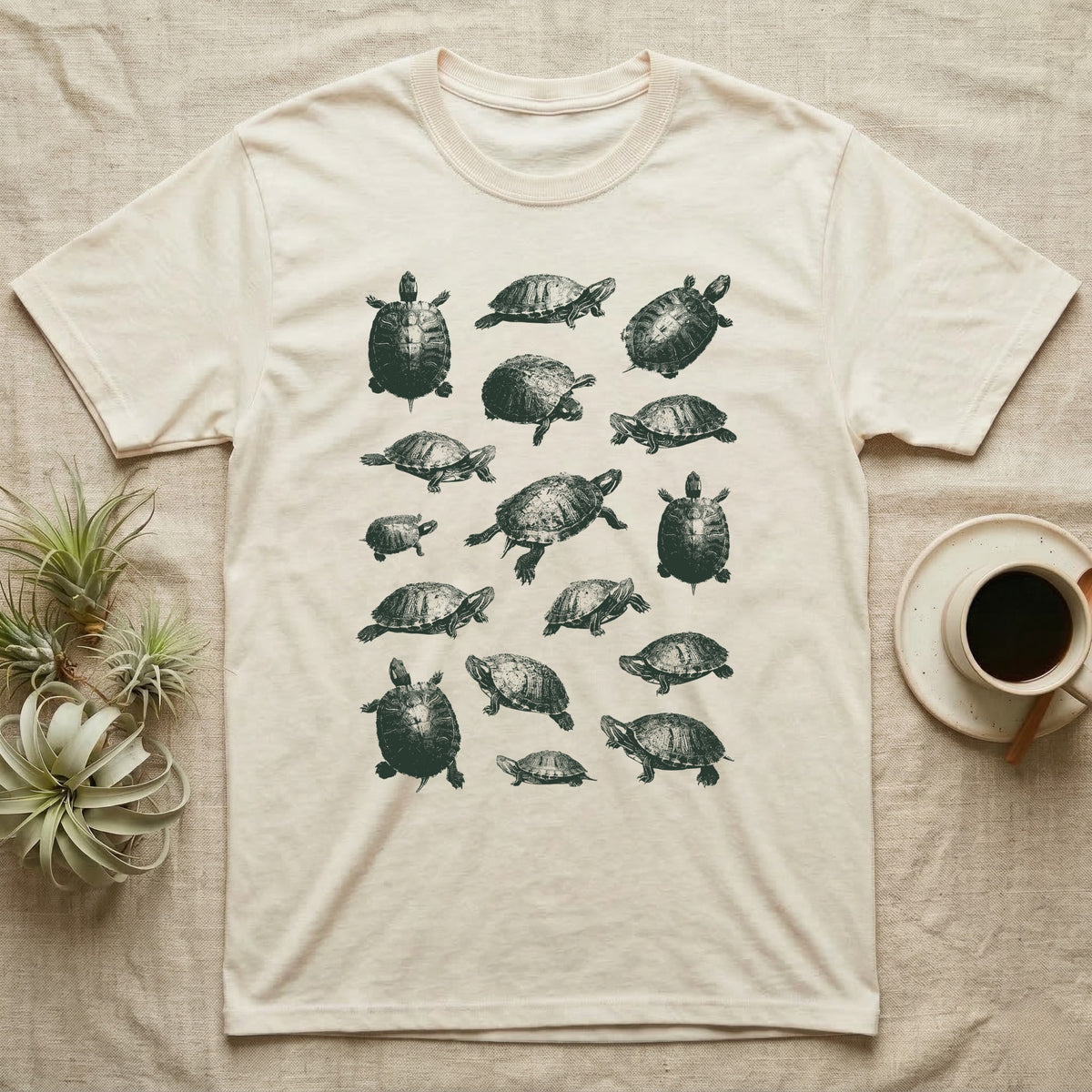 Red-Eared Slider Scatter T-Shirt in Natural — Seventeen red-eared sliders in one olive-green screen-print ink, scattered at varied scale, angle and size.
