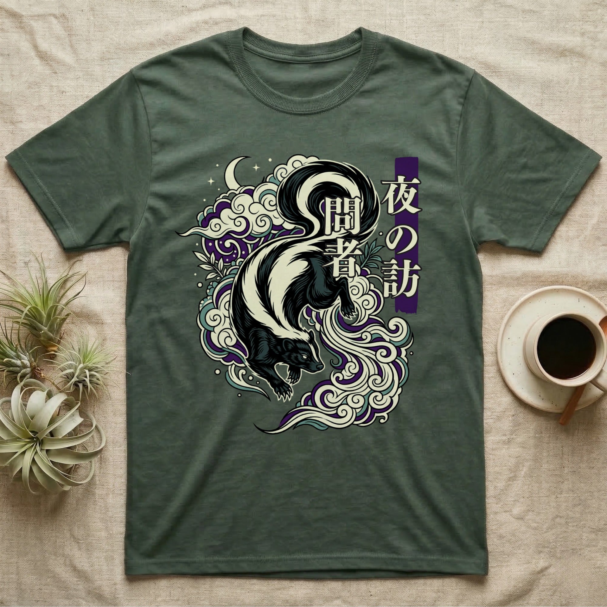 Skunk amidst swirling clouds and Japanese text, on a dark green t-shirt.