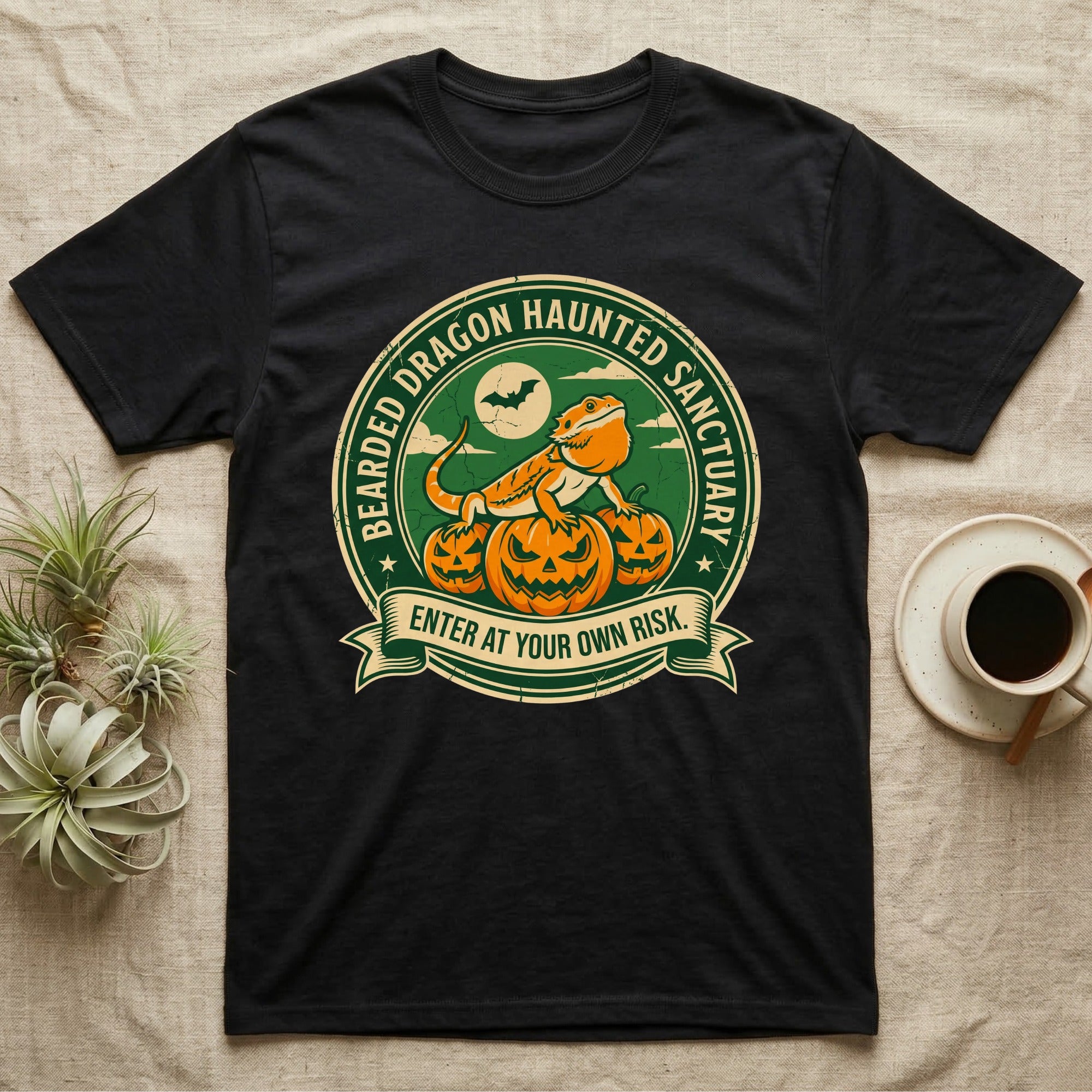 Bearded Dragon Haunted Sanctuary T-Shirt in Black — Vintage badge of a bearded dragon on glowing pumpkins under a moon, "Bearded Dragon Haunted Sanctuary."