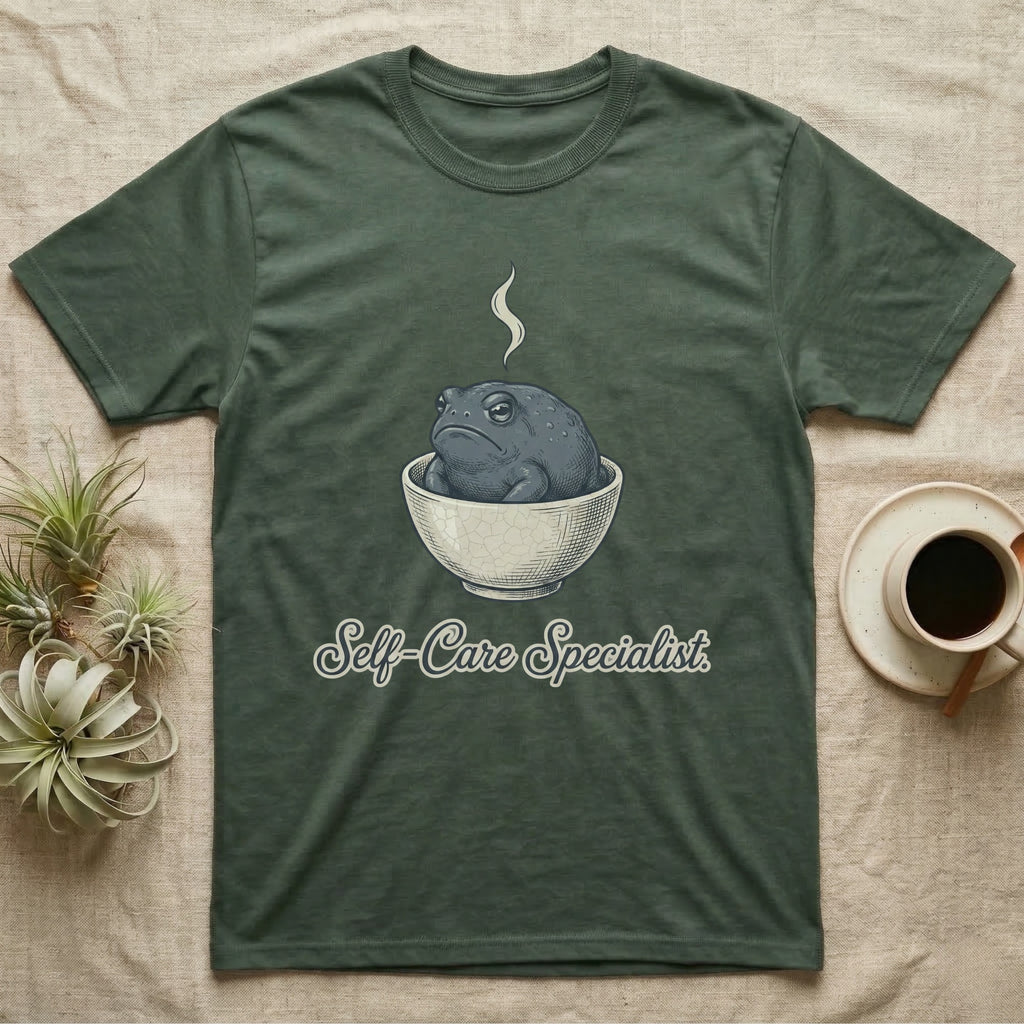 T-shirt with a toad in a bowl and "Self-Care Specialist" text.