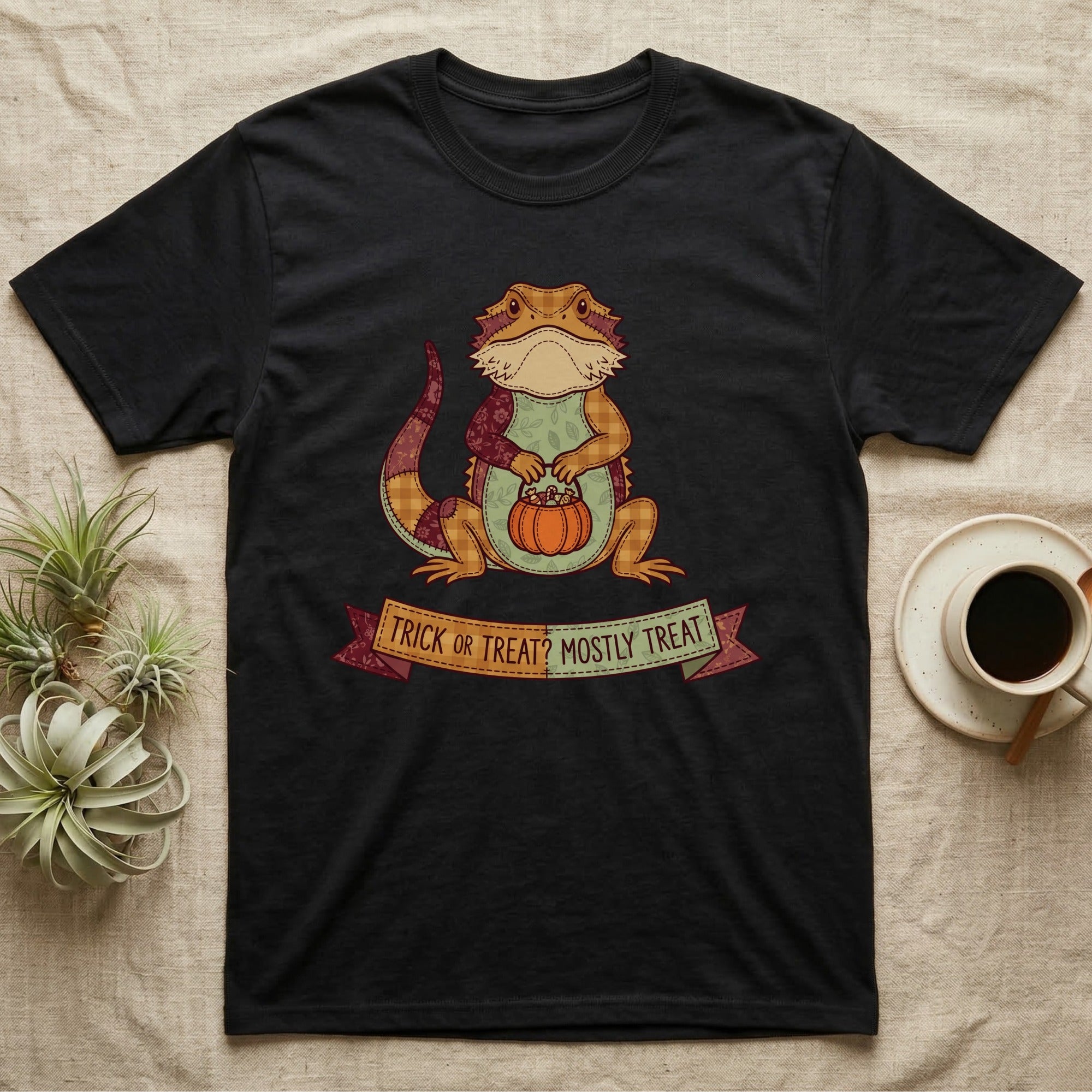 Bearded Dragon Mostly Treat T-Shirt in Black — Patchwork-quilt bearded dragon holding a pumpkin pail, banner reading "Trick or Treat? Mostly Treat."