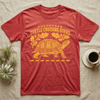 Box Turtle Crossing T-Shirt in Heather Red — Yellow folk-print eastern box turtle walking across a dashed road line with oak leaves, text Volunteer Turtle Crossing Guard