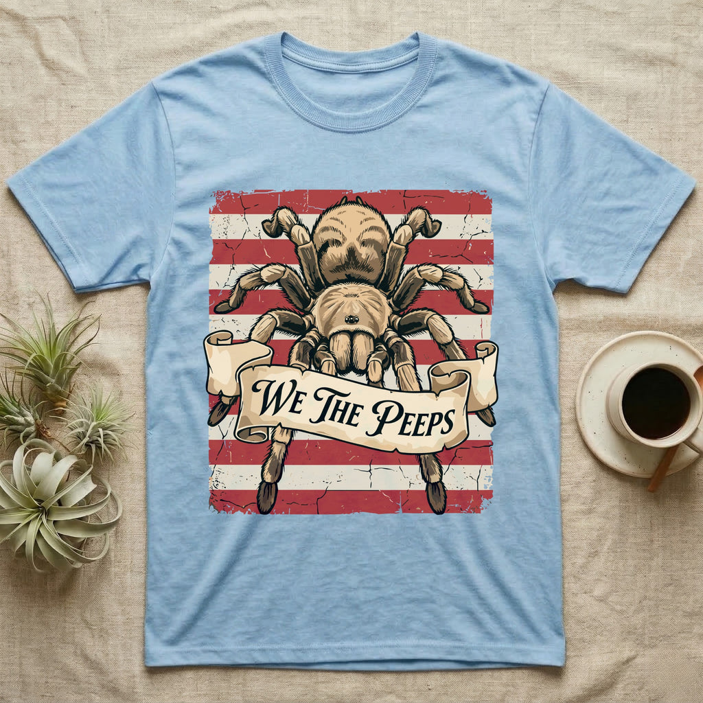Tarantula We The Peeps T-Shirt in Light Blue — Detailed tarantula over a distressed striped flag holding a banner scroll reading We The Peeps.