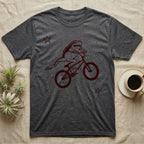 Tree Frog Can-Can T-Shirt in Dark Heather — Distressed one-ink oxblood screenprint of a White's tree frog airborne on a BMX bike, both back legs kicked off the pedals and swung to one side, hands still on the bars.